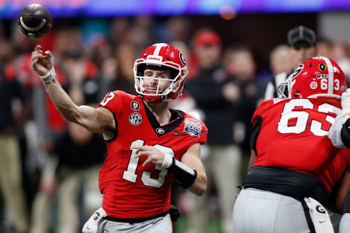 Georgia quarterback Stetson Bennett (13) throws a pass during the second half on Saturday. (Joshua L Jones/USA TODAY Sports)_